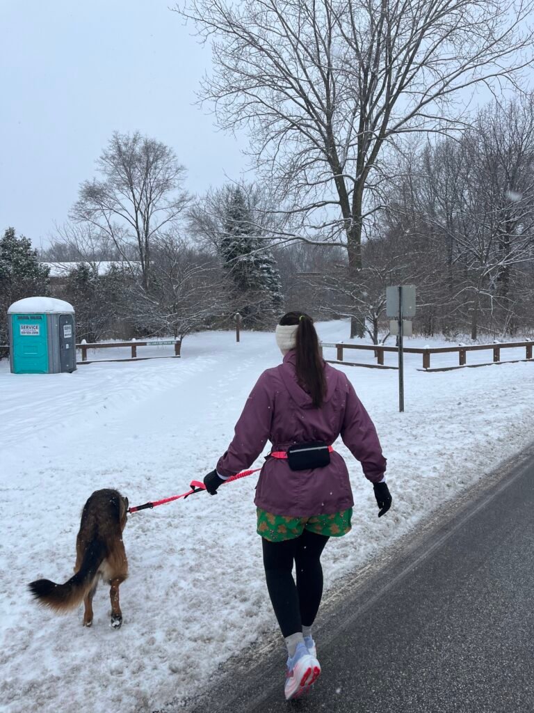 winter running gear laid out for running in the snow