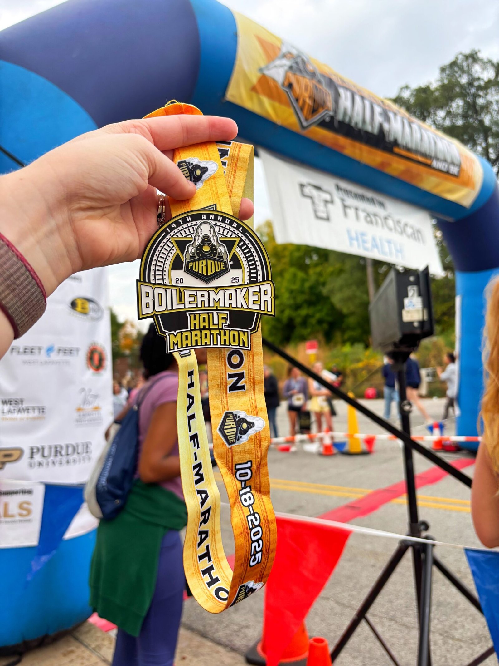 half marathon finisher medal after recovering from runner's knee