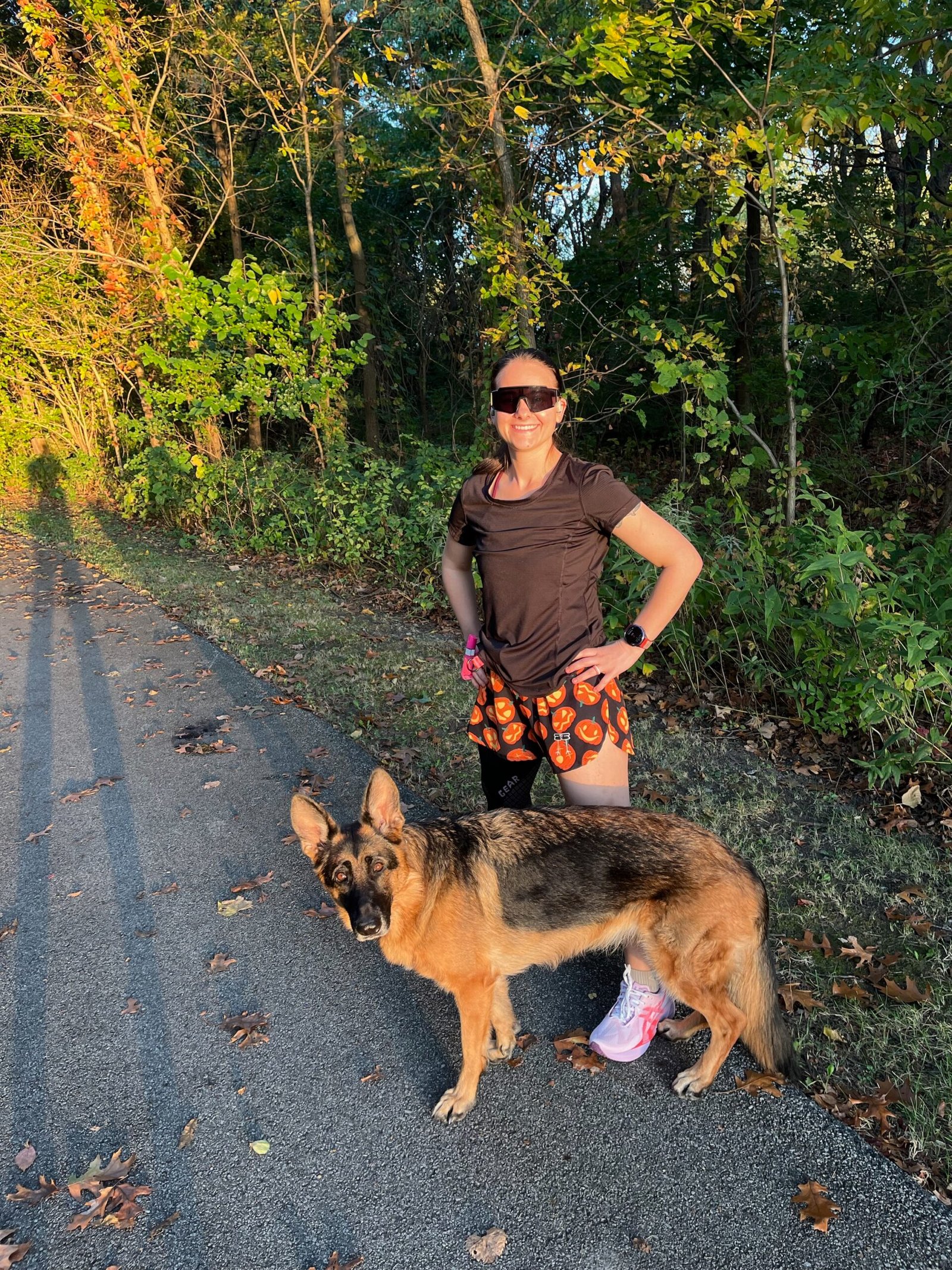 runner wearing a knee compression sleeve before a run with her dog
